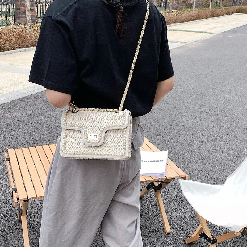 

2021 New High-quality Pearl Straw Woven Bag Shoulder Messenger Bag Pearl Chain Small Square Bag Lady Underarm Bag Western Style