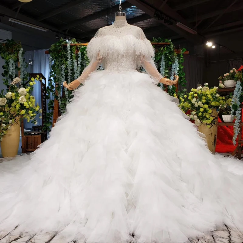 2019 Luxuy Cystals Top Feathers Wedding Dress Sexy Transparent Layers Skirt Puffy Ball Gown Bridal Gown Custom Made Ball Gown