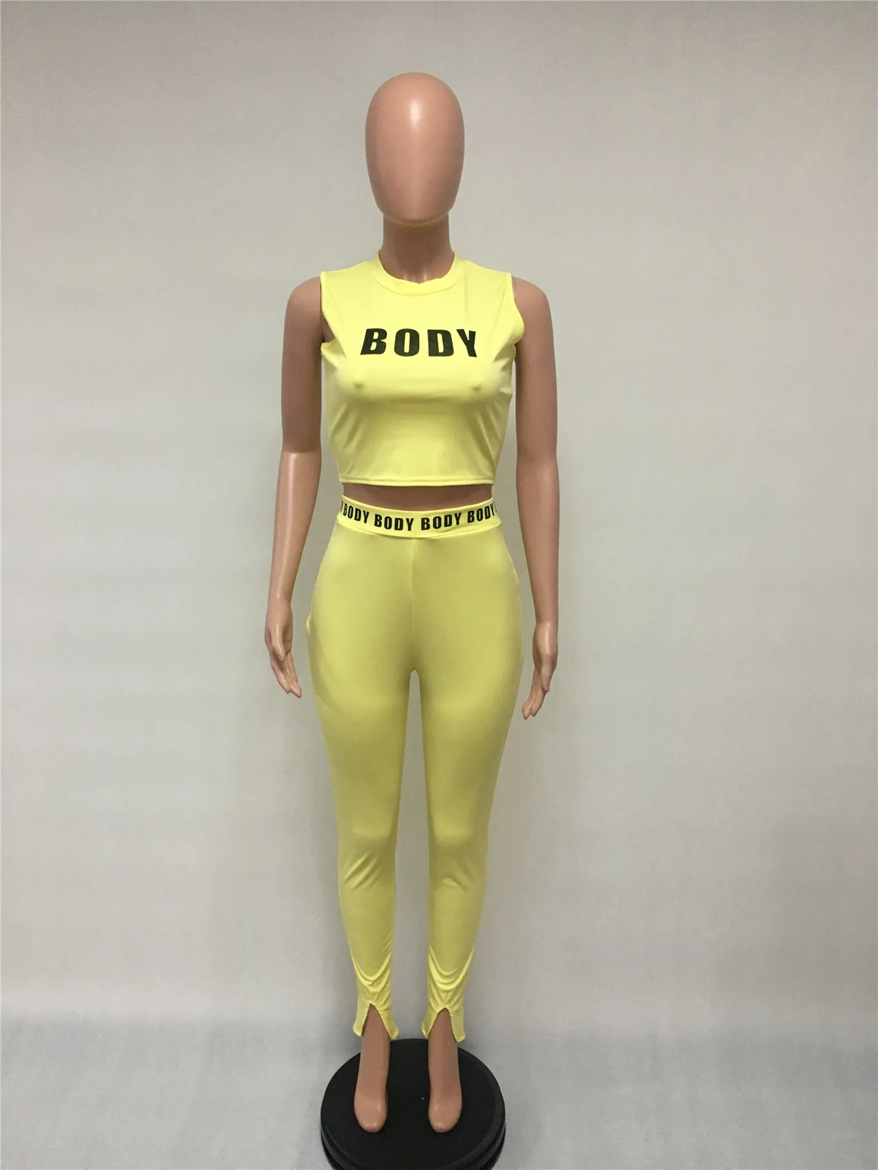 

Women Fitness Two Pieces Set Tracksuit Sleeveless Crop Top Letters Elastic Skinny Leggings Split Pants Sportswear Slim Outfit