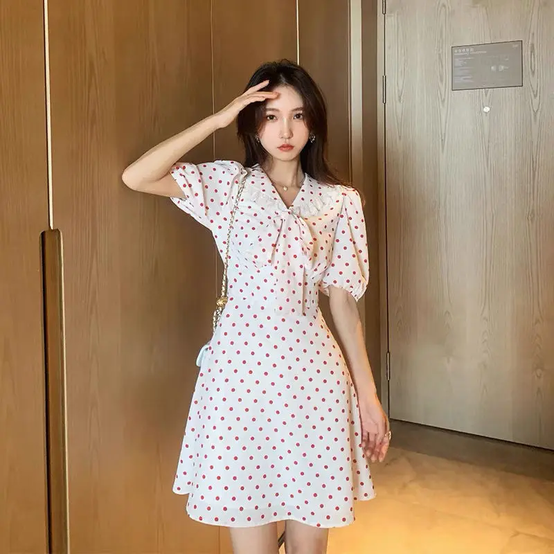 

2021 spring and summer new French Hepburn wind wave point temperament sweet lapel bow waist A- shaped dress women