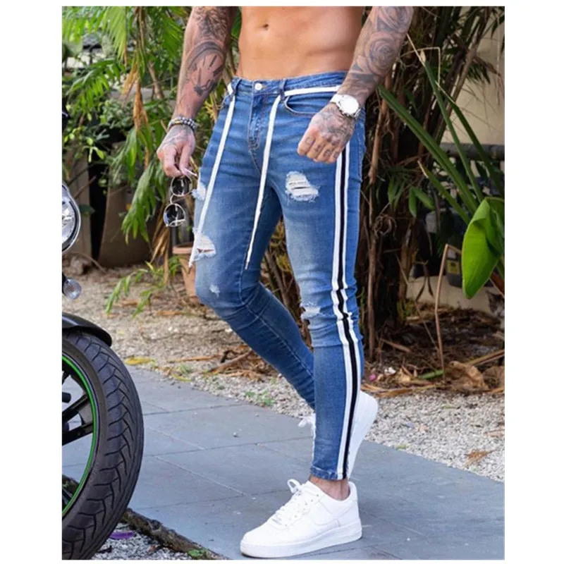 

Новые мужские облегающие джинсы, байкерские потертые джинсовые рваные брюки-карандаш в полоску сбоку, уличная одежда в стиле хип-хоп, джинс...