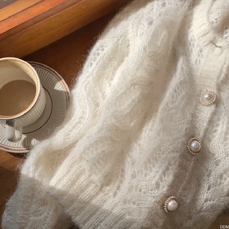 

New women's cardigan gentle mohair hook flower hollow breathable thin knit sweater big button sexy top coat