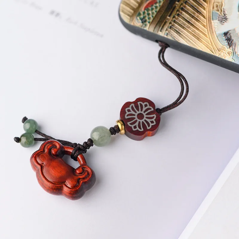 

Chinese element rosewood carving Ruyi lock pendant mahogany pendant retro ethnic longevity safe lock pendant mobile phone chain