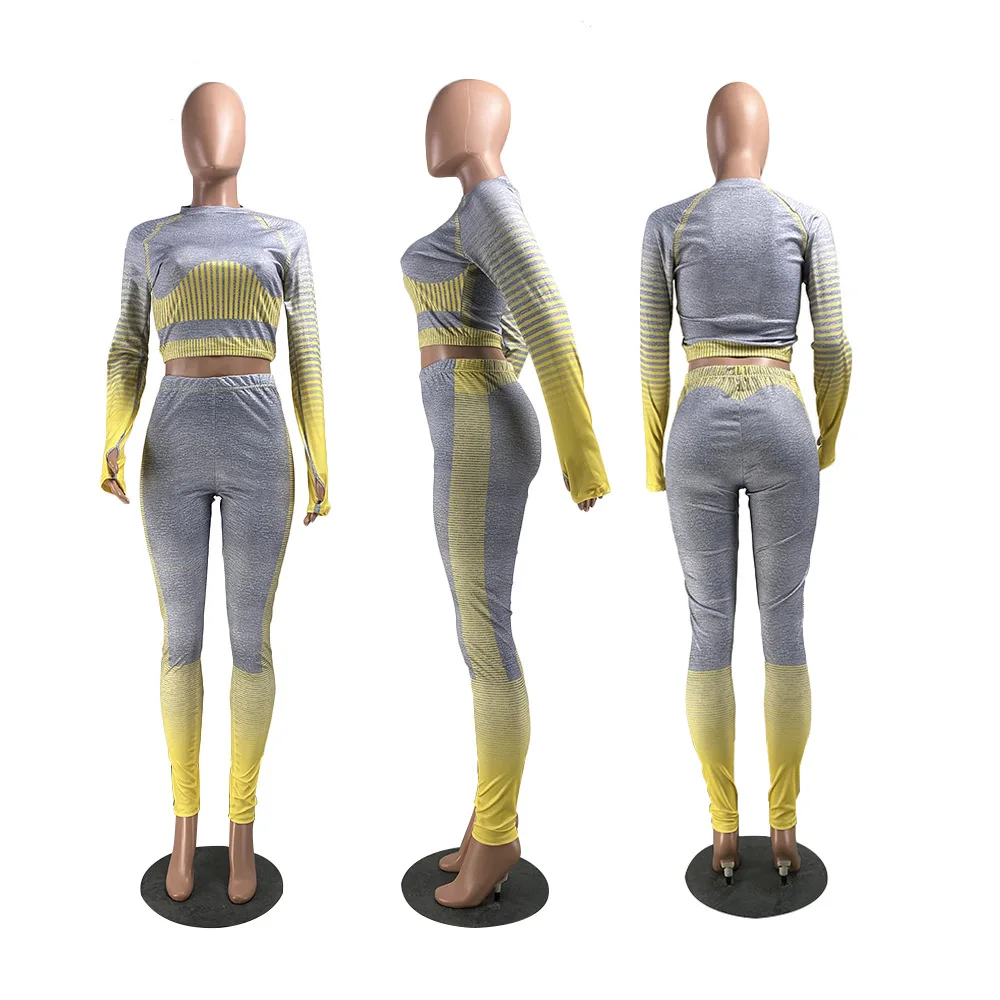 

2021 spring new fashion solid color splicing sports two piece slim fit o-neck long sleeve top and trousers women's suit