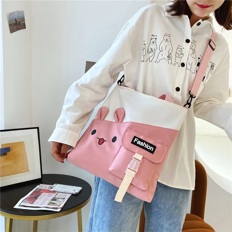 

Large-capacity Japanese canvas handbag 202 new Korean version contrast stitching small fresh student cute messenger bag girl.