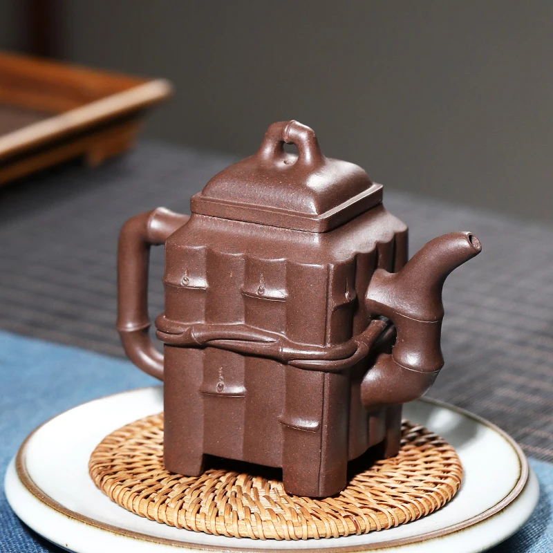 

Yixing pure manual undressed ore old purple clay are recommended by master authentic bamboo tea set a pot of two cups