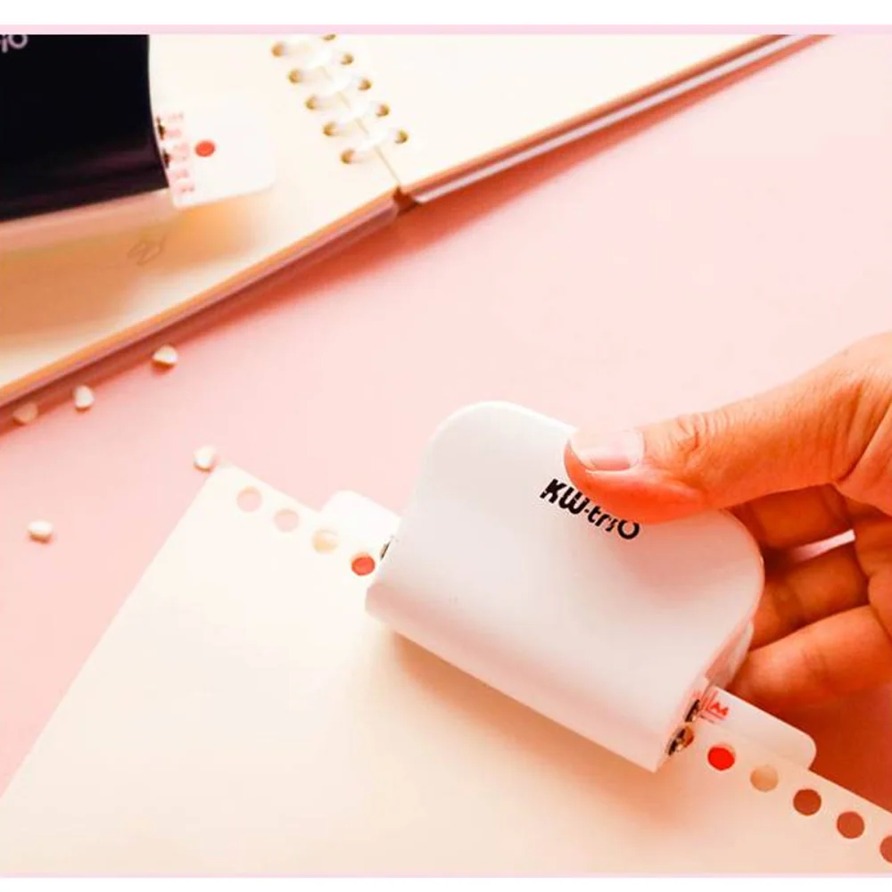 

1Pc 26 Holes Puncher A4 Paper Notebook Stationery Puncher DIY Handheld Puncher Tool for Students (White)