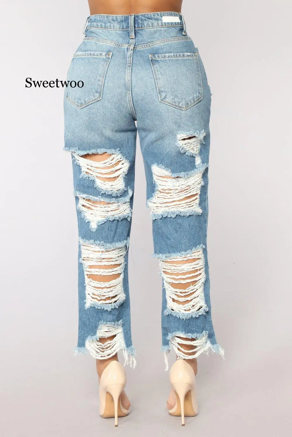 Соблазнительные рваные джинсы с эффектом потертости завышенной талией и