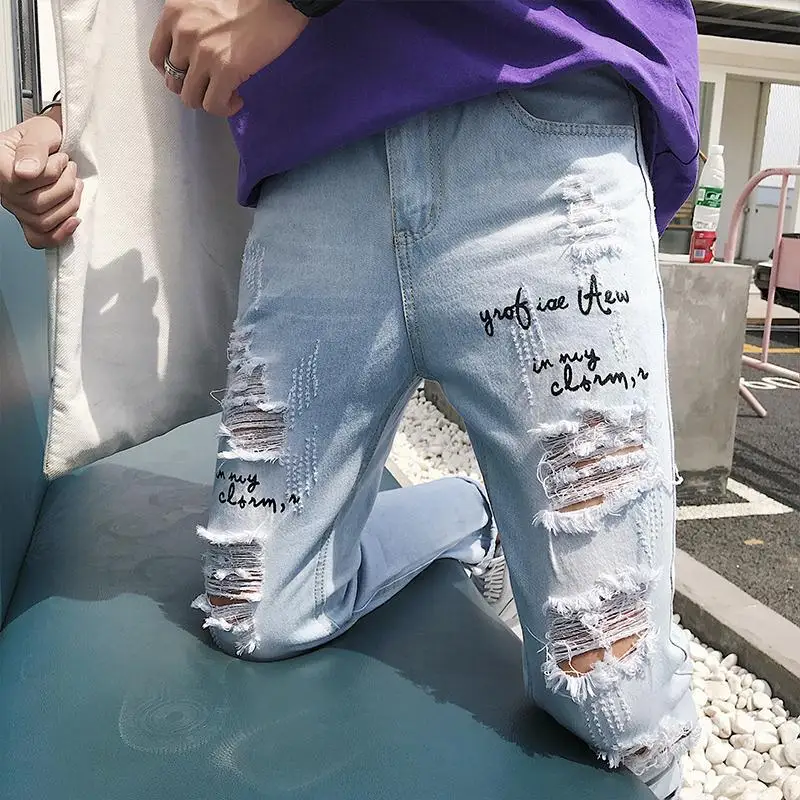 Super-hot oversized ripped jeans men's broken copper loose-fitting beggar South Korea scraped ninth pants pencil jeans for men