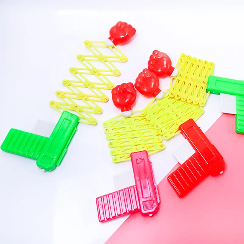 

Party Festival Gift For Fun Classic Elastic Telescopic Fist Toys Plastic Retractable Fist Shooter Trick Toy Gun Funny Child Kids