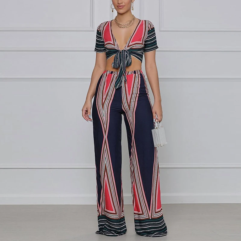 

Женский летний комплект из двух предметов, укороченный топ с коротким рукавом и завязками спереди и свободные длинные брюки, элегантный кос...