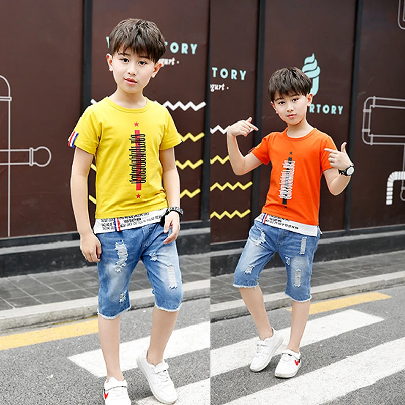

Boys girls clothes Suit fashion cartoon letter printed sweatshirt T-shirt Splicing hem + jeans five-point pants Quality clothing