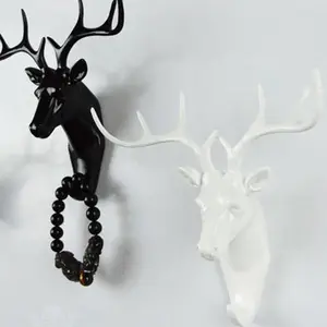 Вешалка настенная с несколькими крючками, в виде головы оленя