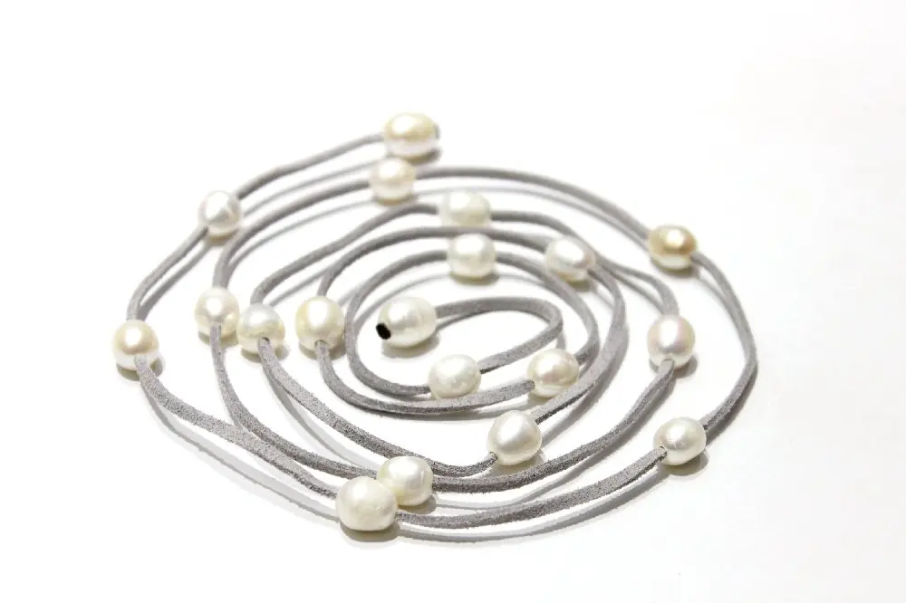 

White freshwater pearls and leather rope necklace