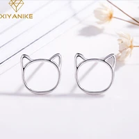 xiyanike silver color new fashion cute hollow cat stud earrings prevent allergy for women small ear hoops animal jewelry