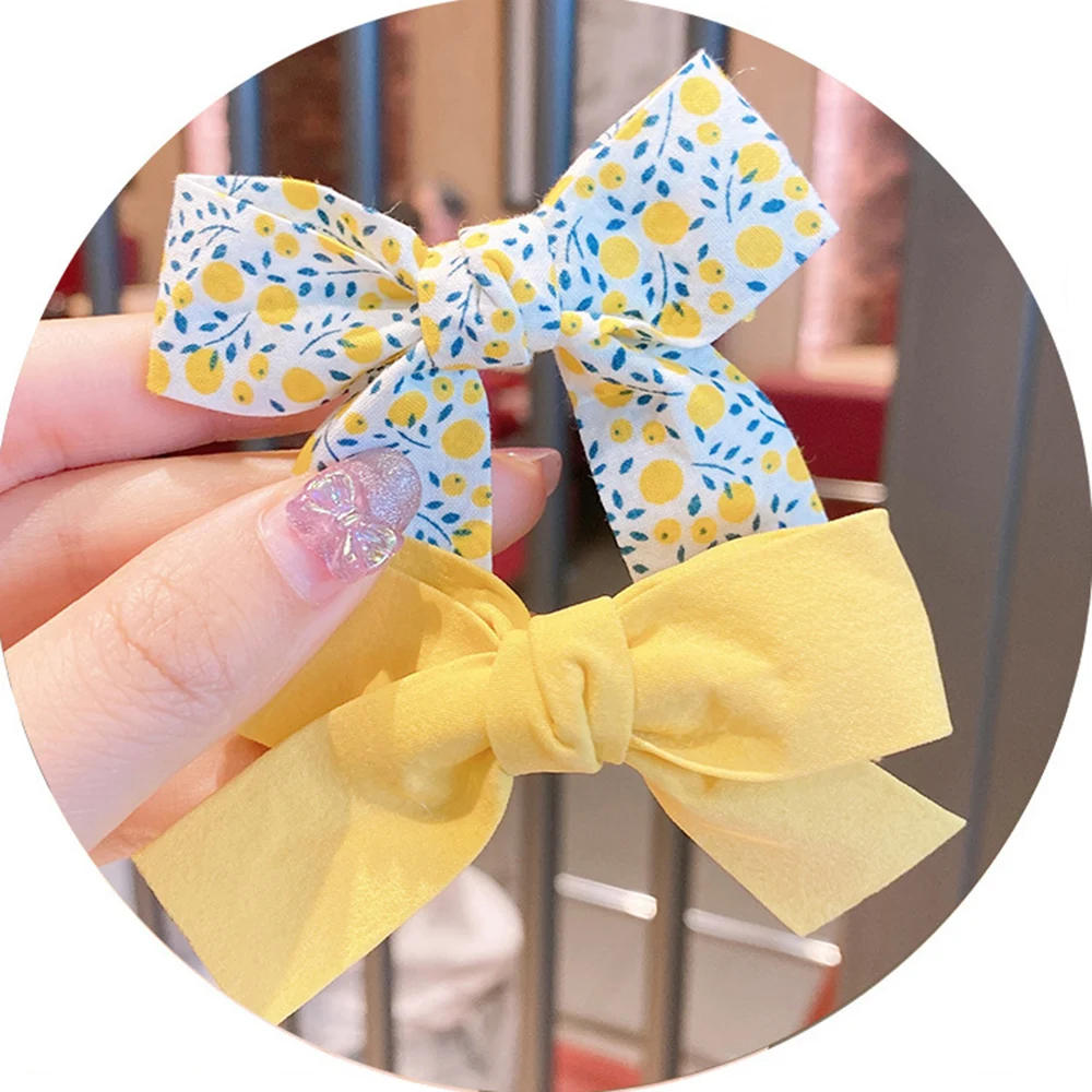 

2Pcs/Set Kid Girls Hair Clip Pink Yellow Orange Floral Flower Printed Bowknot Hair Clip Hairpins Barrettes Hair Accessories