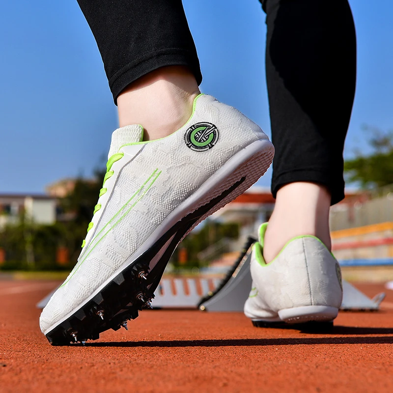 

New Women and Men Breathable Running Shoes Professional Track and Field Spikes Lightweight Cushioning Track and Field Shoes Men