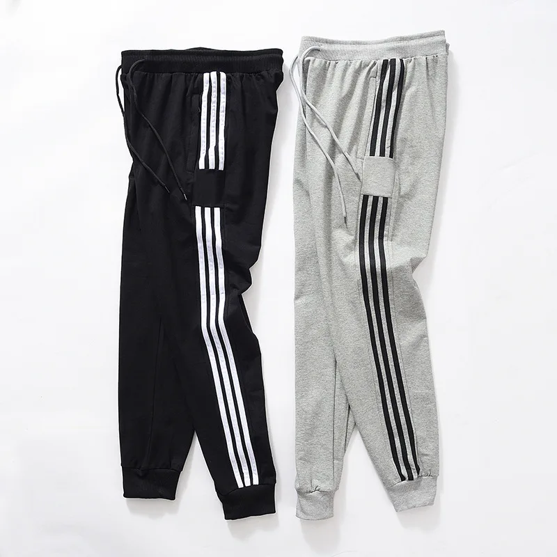 

spring and autumn new sports pants for young students three bar binding casual pants for men's loose pants wholesale