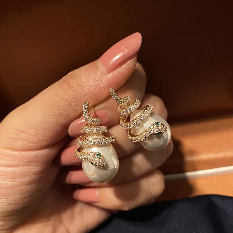 

S925 Korean Silver Needle Snake Shape Earrings Pearl Net Red Earrings European and American Snake Shaped Wrapped Pearl Jewelry