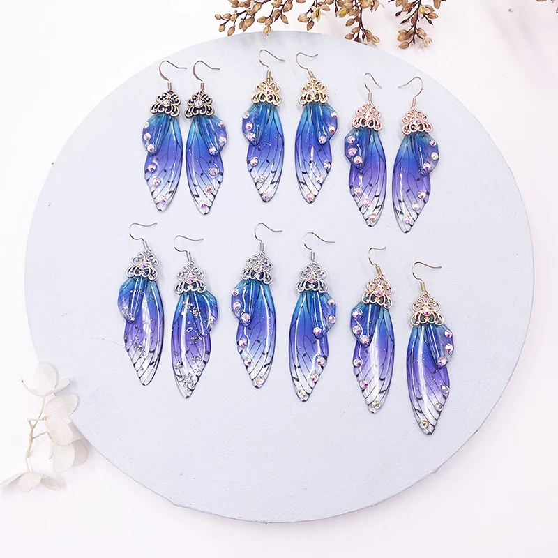 Серьги-подвески неоновые розовые голубые фиолетовые стразы крылья цикады 1 пара -
