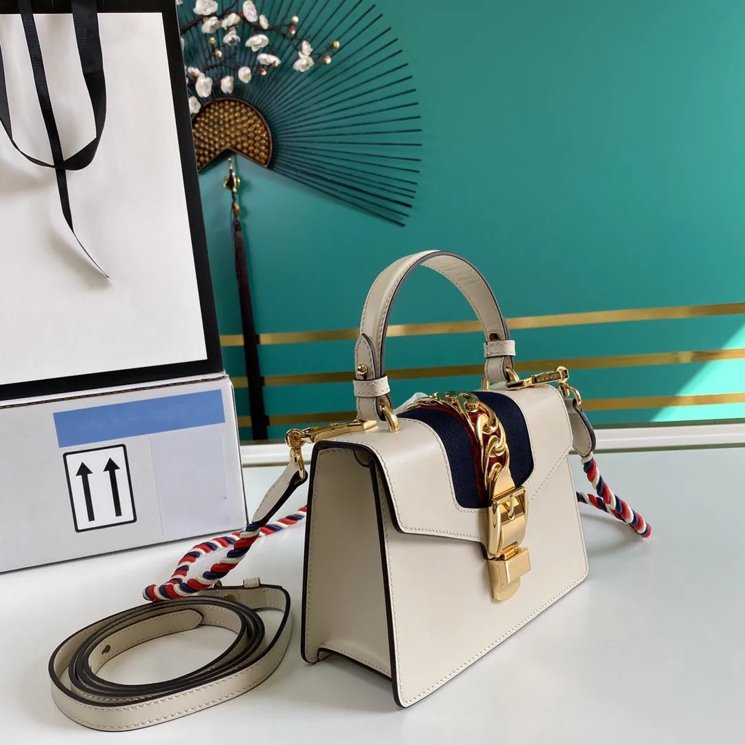 

2021 New White Top Leather High Quality Hardware Women's One Shoulder Handbag Pure Color Pattern Design Noble Luxury