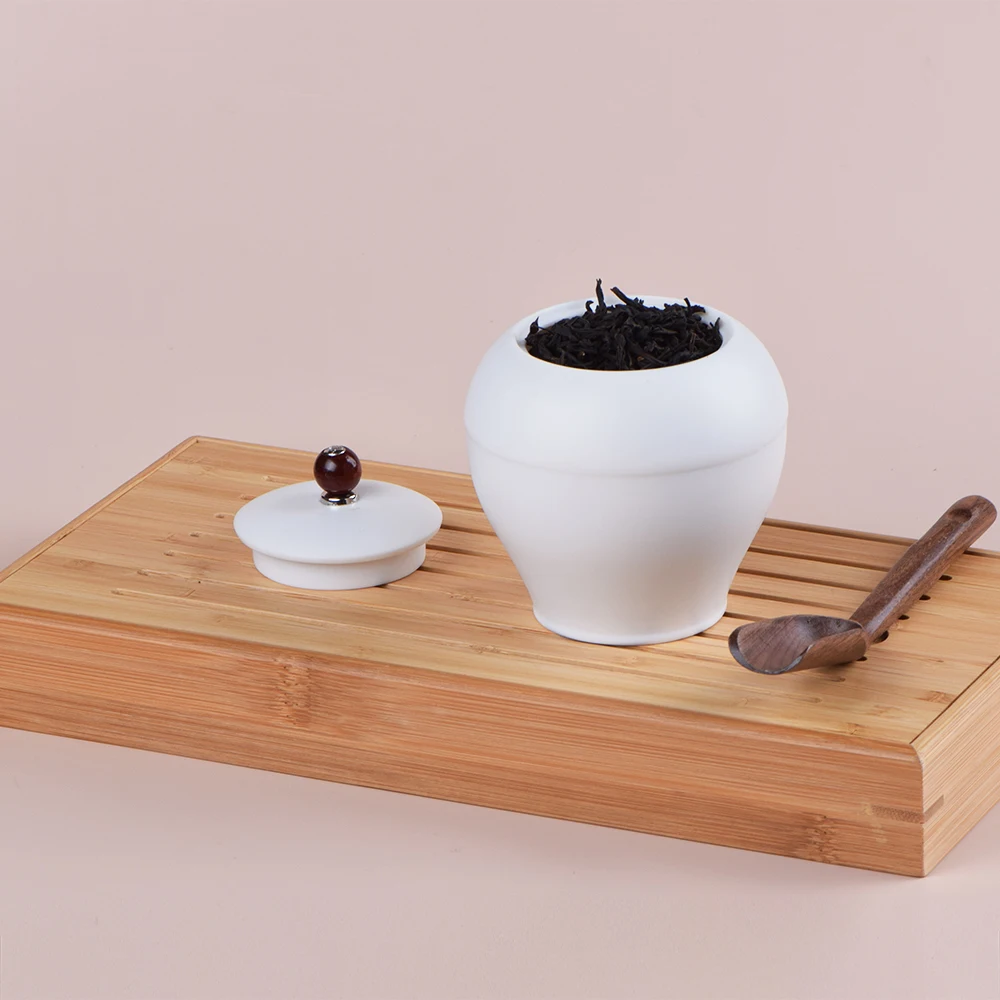 

Dehua white porcelain tea pot Ceramic large tea pot Pu 'er tea box Tea cake tea storage pot