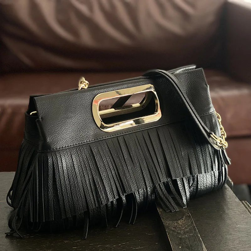 

The first layer of cowhide niche handbag ladies messenger bag leather joker tassel large-capacity fashion bag solid color chain