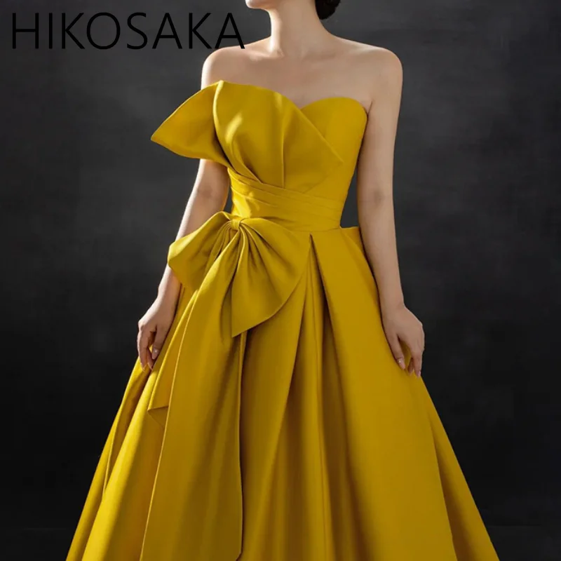 

Платье женское вечернее желтое ТРАПЕЦИЕВИДНОЕ без бретелек, с бантом