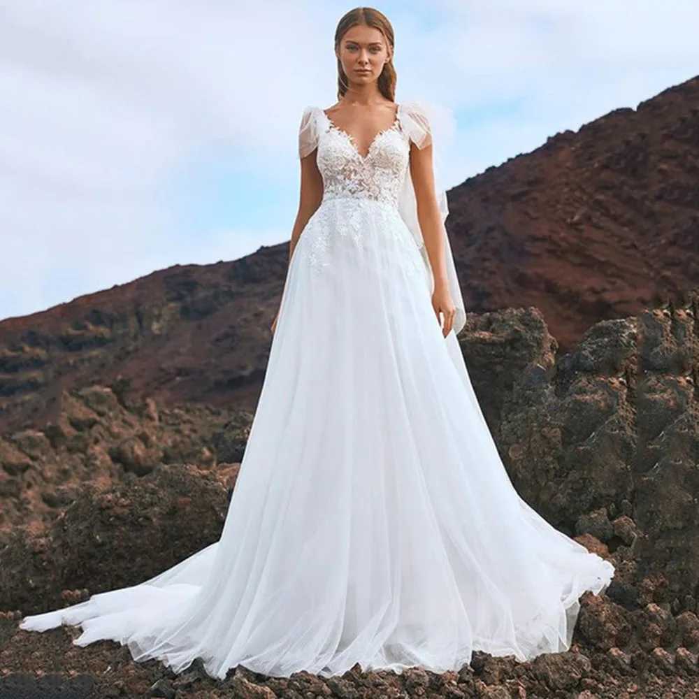 

LoveDress V-Neck Wedding Dress With Detachable Cape Sleeveless Lace Appliques Boho Tulle Bride Gown Backless A-Line Sweep Train