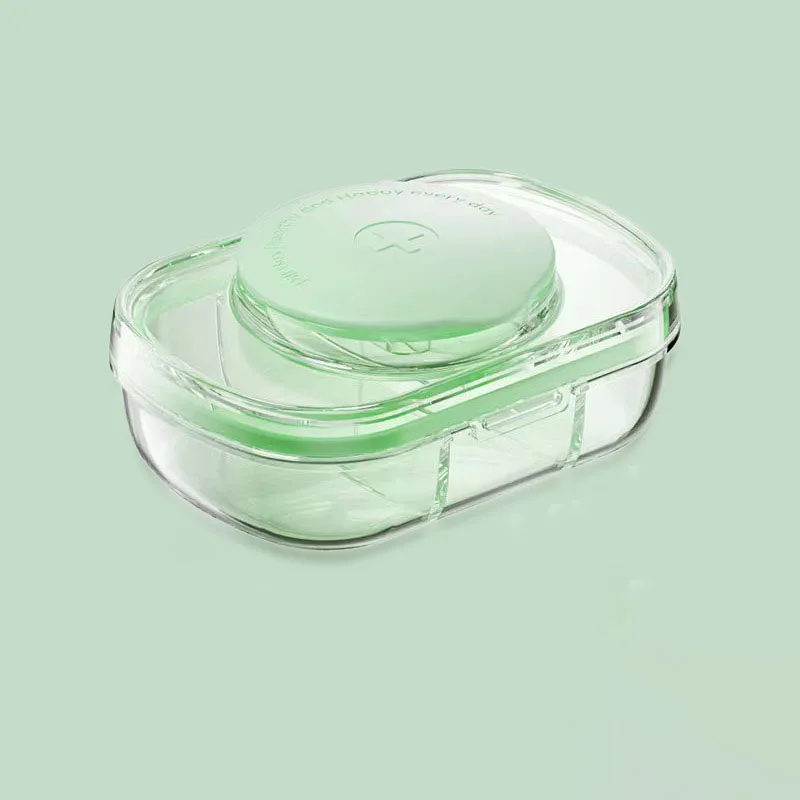 Прозрачная зеленая портативная коробка для дозирования лекарств семь дней в