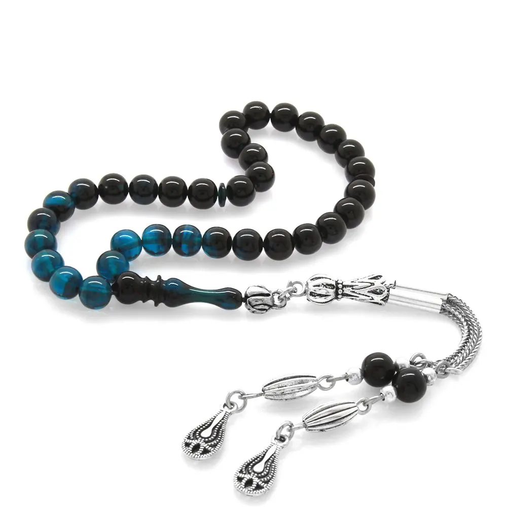 

Nipora Tarnish Metal Tasseled Globe Cut Wrist Length Filtered Turquoise-Black Fire Amber Rosary
