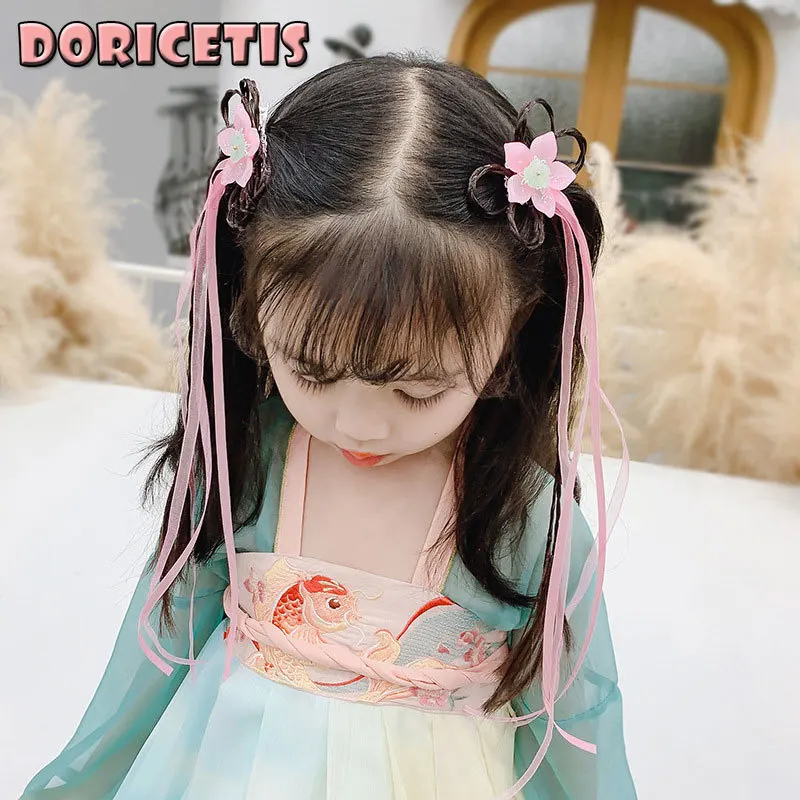 

Детская заколка с бантом и кисточками для девочек