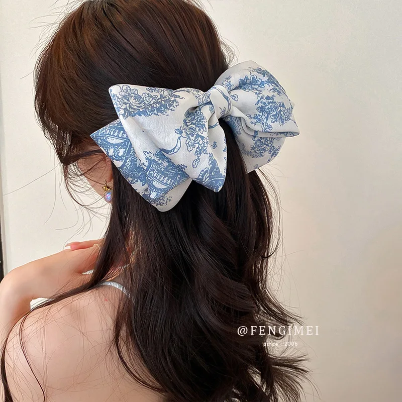 

Dongdaemun Net Red Broken Flower Bow Hairpin Back Head Coil Spring Clip Top Fashion Design Sense Hair Accessories (female)