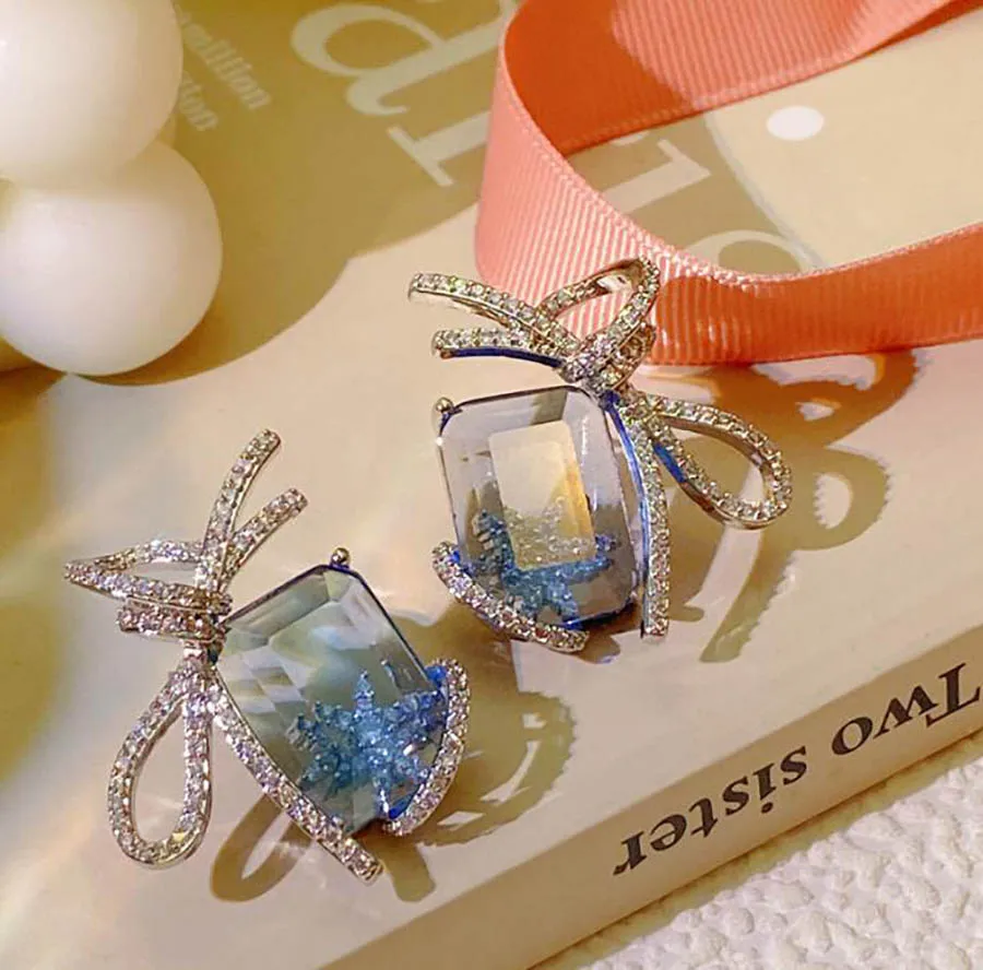 Ice blue first snow bow earrings for women ins design shiny zircon ribbon sweet romance winter romance ribbon ears jewelry