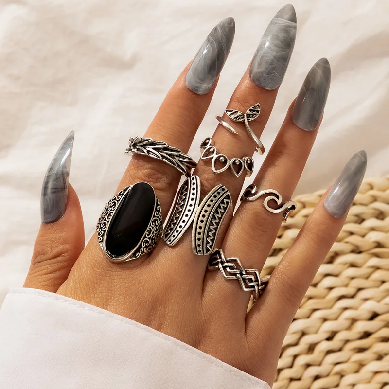 

New 2022 Black Dripping Ring Set Fish Tail Geometric Hollowout Seven-piece Ring Set