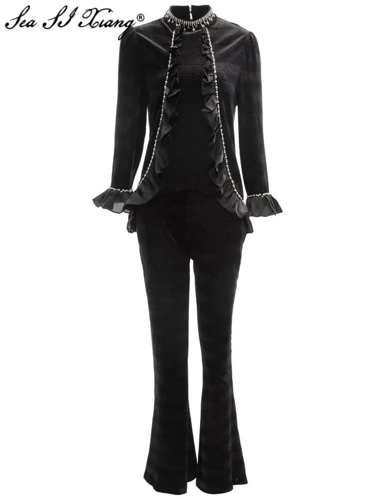 

Женский бархатный костюм с воротником-стойкой, оборками и расклешенными брюками