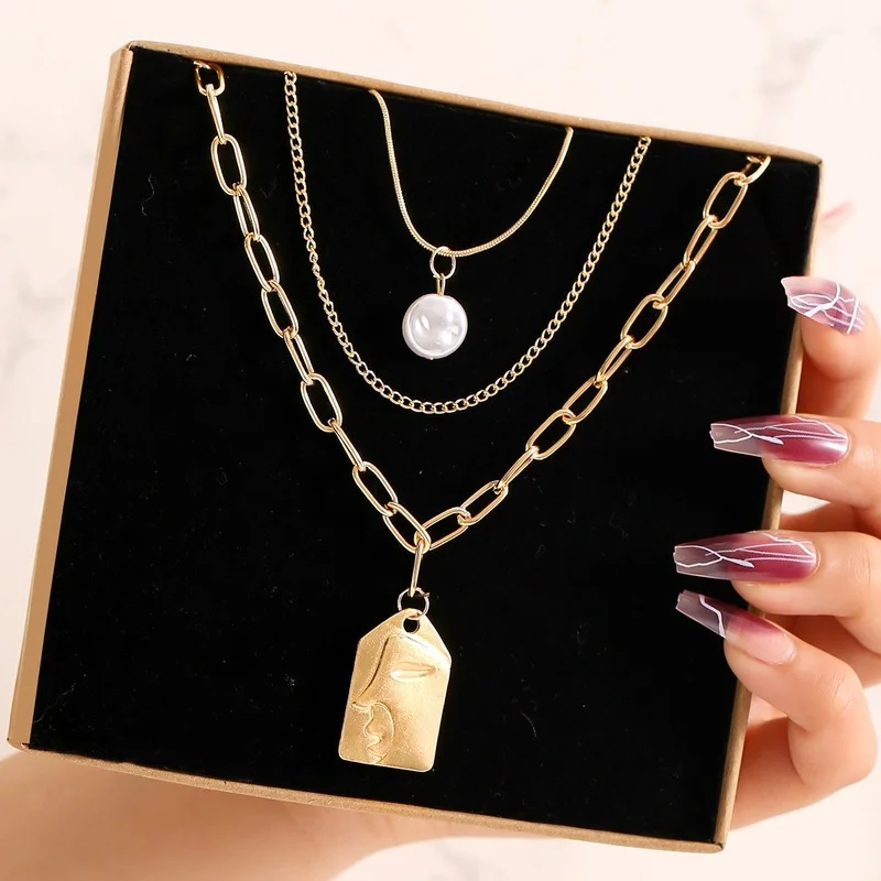 

Necklaces for Women 2022 Sexy Accessories Jewelry Trend Alloy Multi-Layer Pearl Embossed Face Pendant Necklace Korean Fashion