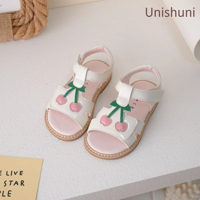 

Unishuni Girls Sandals Kids Patent Leather Summer Shoes Children Open Toe T-Strap Beach Sandals Princess Casual Cherry Flats