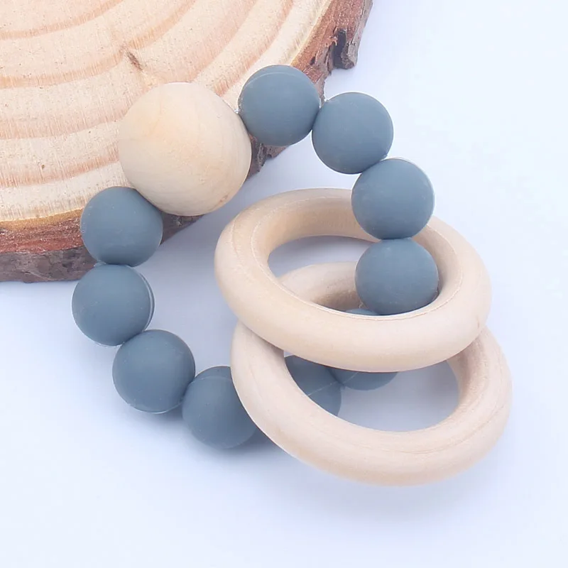 

Baby Teether Bracelet Silicone Beech Beads Ring Wood Rattles Fidget Toy for Baby Girls Boys Teething Nursing Toy Appease