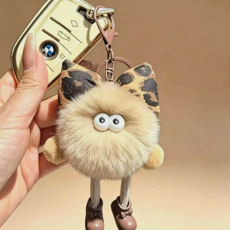 Фото Брелок-монстр с леопардовым принтом и бантом, плюшевый, пушистый, из искусственного меха, с помпоном и большими глазами, для женщин №4