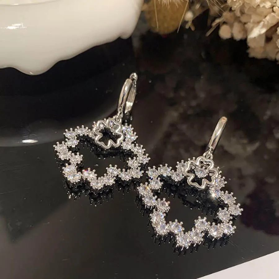 

Flower sweet hollowed out super flash ear buckle lovely girl shiny zircon summer chic fashion jewelry