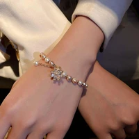 elegant imitation pearl beaded bracelets shiny rhinestone flower pendant bracelets light luxury women wrist ornaments