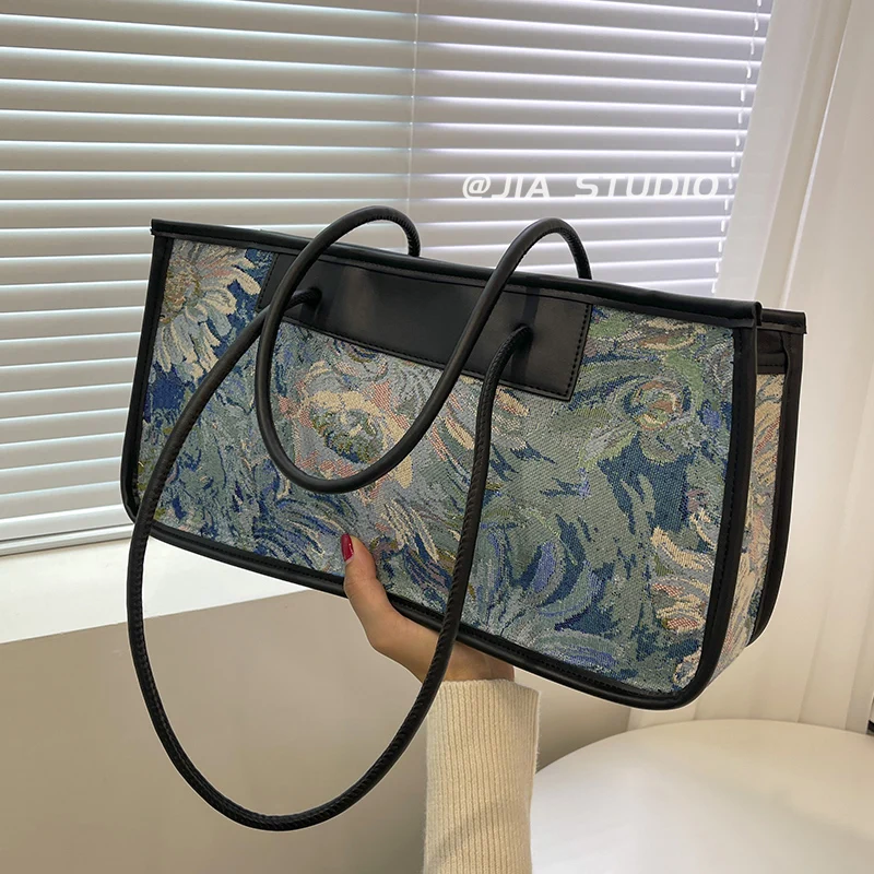 

Canvas fashion large capacity bag women's bag ins advanced sense armpit bag 2022 new minority original Monet oil painting bag