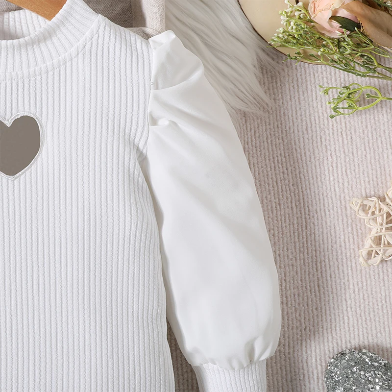 

Детская трикотажная рубашка с рукавами-фонариками и клетчатая мини-юбка