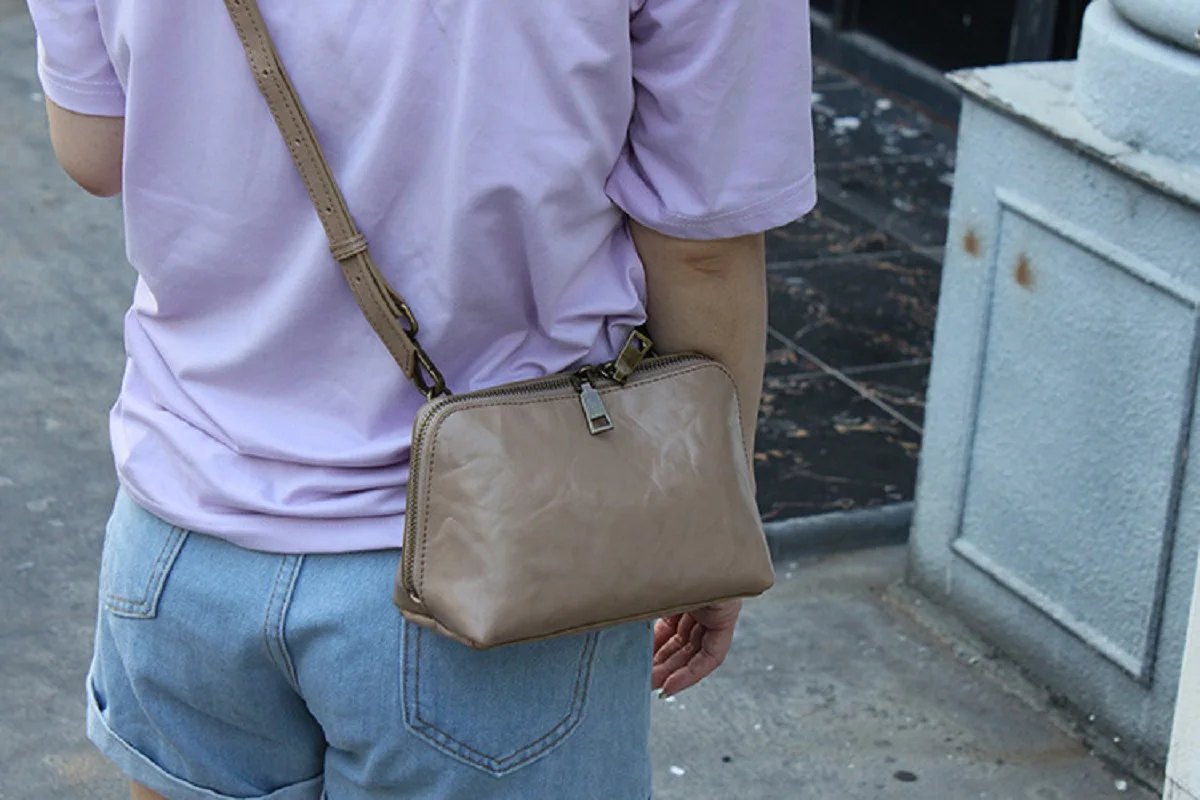 

Head layer cowhide women's bag simple and fashionable small bag retro handbag single shoulder crossbody triangle bag makeup bag