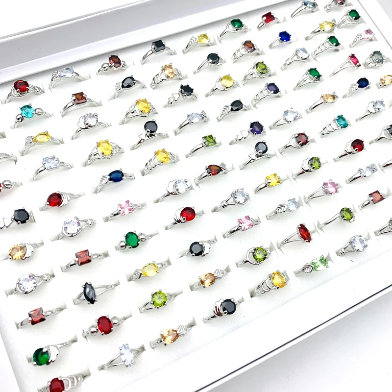 

Кольца женские посеребренные с разноцветным кристаллом циркония, 20/50/100 шт.