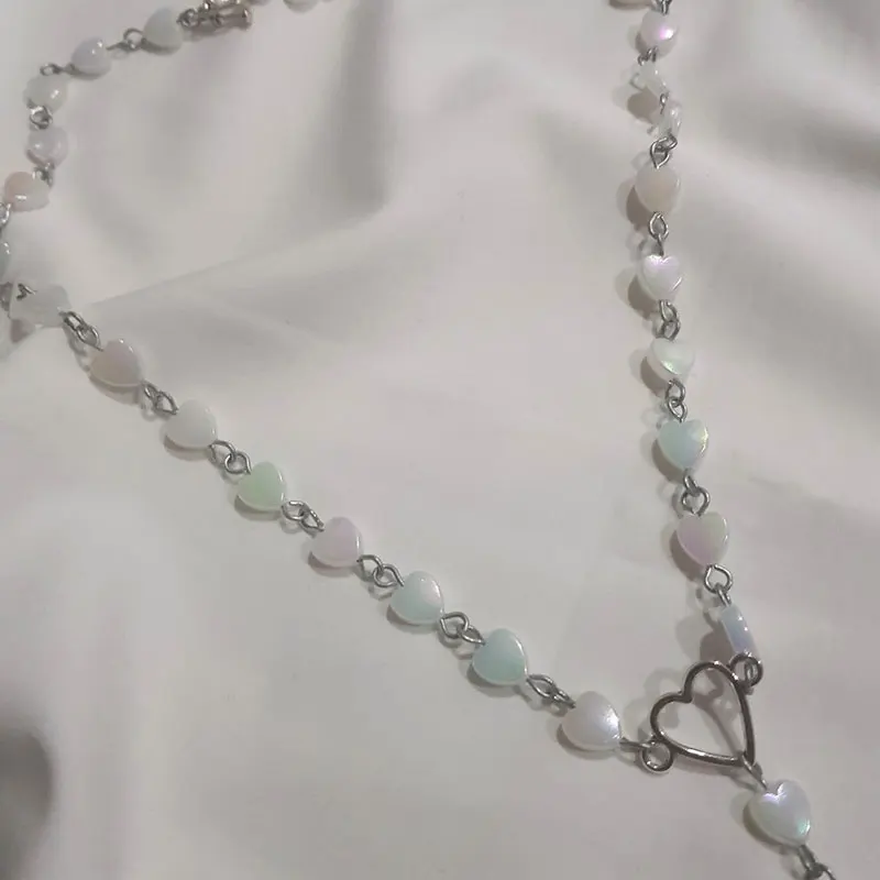 

Iridescent heart-shaped rosary silver droplets charm alternative alt cute beaded hand-assembled pastel fairy core rainbow