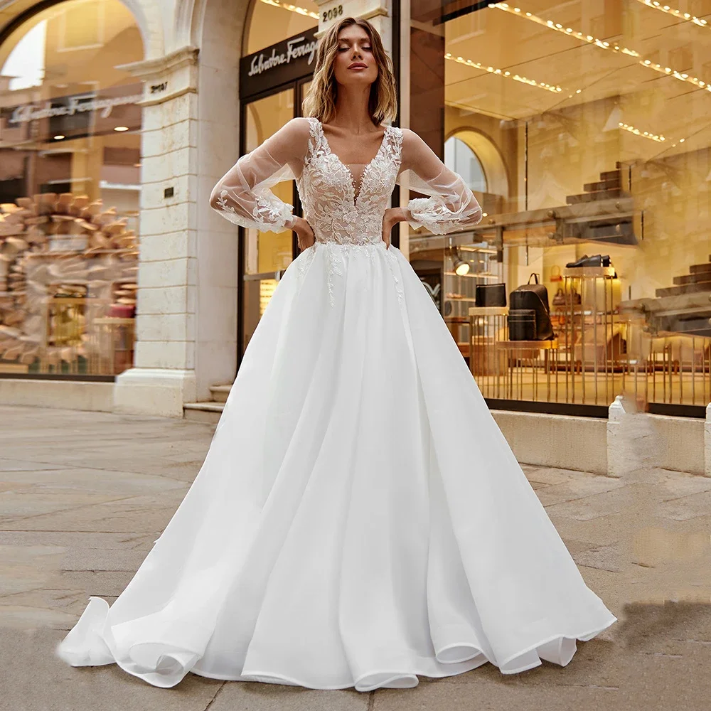 

Charming A-Line Lace Wedding Dress V-neck Appliqued Long Sleeves Button Back Bridal Gown Sequined Pearls Bead Vestidos De Novia