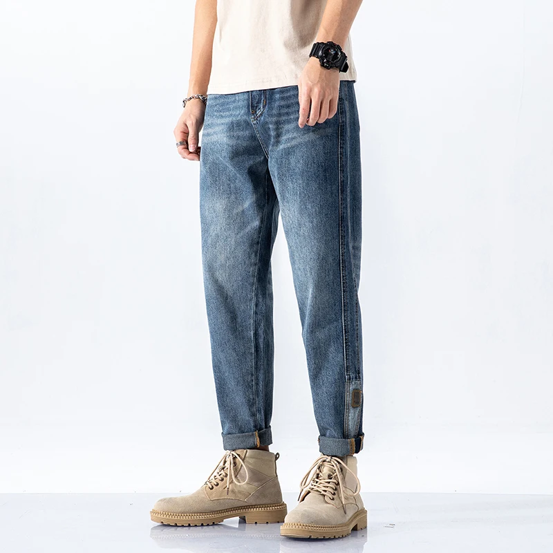 

New spring and autumn trousers with small leather brand casual jeans