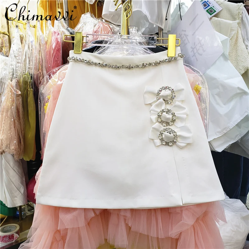 

2022 Spring New Ladies Fashion Sweet Rhinestone Buckle Bow Split Short Skirt Women's Elegant Solid High Waist A- Line Hip Skirt